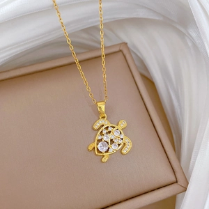 Luxurious hollow turtle necklace in gold titanium steel with sparkling zircon stones