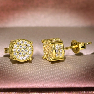 Close-up of gold round stud earrings featuring micro-pave cubic zirconia crystals