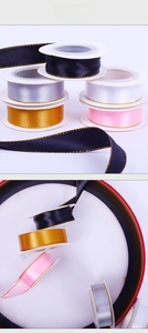 Macro detail of multi-color polyester satin ribbons with elegant gold metallic edges