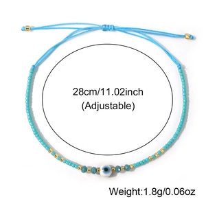 Bohemian evil eye beaded bracelet with blue seed beads and adjustable sliding knot
