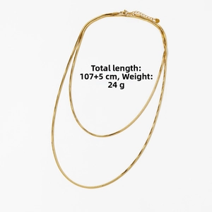 Detailed view of golden double-layer snake chain with lobster clasp and extension