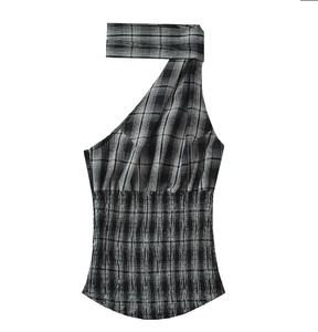 Detail of checkered one-shoulder halter top featuring intricate waist smocking texture