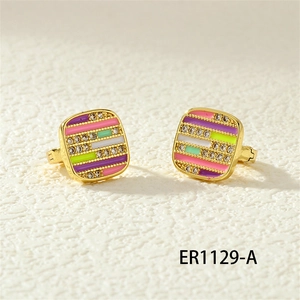 Detail of gold enamel earrings with pink stripes and micro-inlaid cubic zirconia