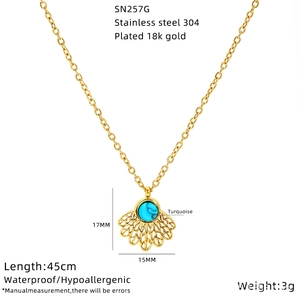 Detail of 18K gold plated stainless steel necklace with turquoise sunflower evil eye charm