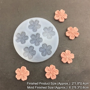 Round silicone mold with 4-cavity cherry blossom shapes for fondant and resin crafts