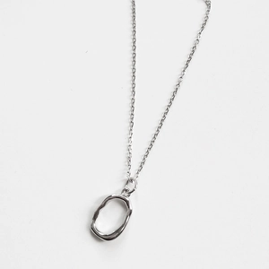 Minimalist 925 sterling silver necklace with irregular oval pendant on white background