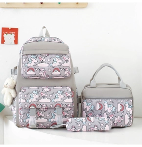 Three-piece school bag set featuring unicorn and rainbow patterns with lunch bag and pencil case