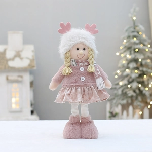 Pink plush Christmas girl doll with deer antlers and plaid scarf in festive setting