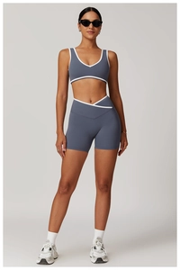 Close-up of cross high waist fitness set with contrast trim and backless sports bra detail