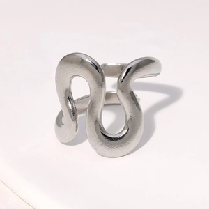 Detailed top view of silver wavy stainless steel ring with polished abstract texture