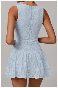 Detailed back view of a light blue lace mini dress featuring invisible zipper and ruffled hem