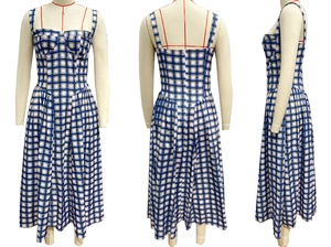 Detail of blue and white plaid corset dress with high waist A-line design on mannequin