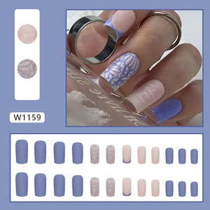 Matte blue and purple press-on nails with floral art and Follow Your Heart design