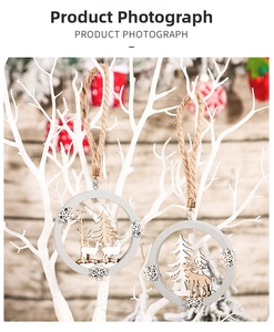 Close-up of wooden Christmas ornament with reindeer and forest scene in rustic style