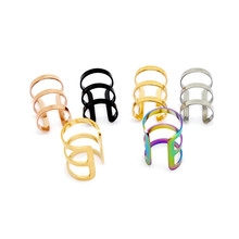 Detail of 6-piece ear cuff set in various finishes including gold, black, and rose gold