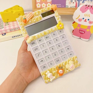 Detail of DIY cream glue calculator with cute bunny, stars, and flower decorations