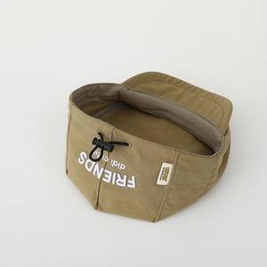 Detail of khaki canvas beret with embroidered white lettering and brand woven label