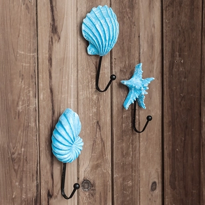 Set of 3 vintage ocean style blue metal wall hooks with shell and starfish resin designs