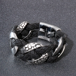 Macro view of 316L stainless steel clasp with woven leather texture on bracelet