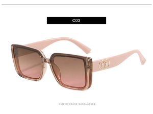 Detail shot of C03 gradient pink oversized sunglasses with metal accents and resin frame