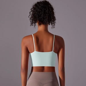 Close-up of mint green high-impact sports bra with thin straps and elastic fabric