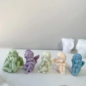 Five colorful angel-shaped candles with white silicone molds in high clarity