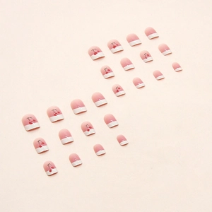 French press-on nails with cute cherry pattern in nude pink and white finish