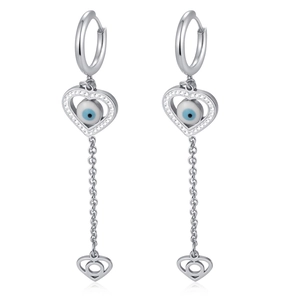 Detailed macro view of silver tassel earrings with evil eye motif and zircon hearts