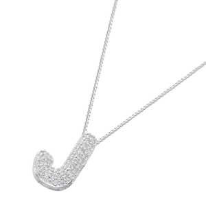 Macro detail of iced-out letter J pendant with micro-pave cubic zirconia on box chain
