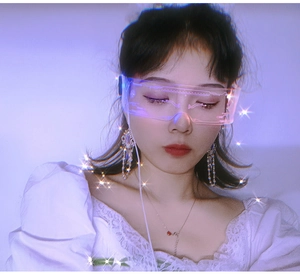 Close-up of LED cyberpunk glasses with circuit patterns and blue-purple glowing lenses
