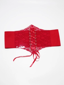 Detail of red floral lace waist cincher with elastic band and gold metal eyelets