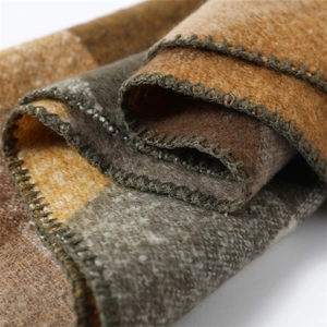 Detail shot of multicolor pashmina texture with neat hemmed edges and wool-like fabric