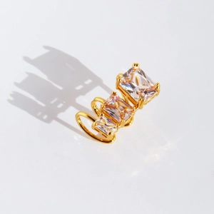 Gold plated geometric square zircon ear cuff with triple crystal stones on white background