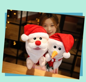 Close-up of cute Santa Claus and Snowman plush hand puppets for Christmas storytelling.