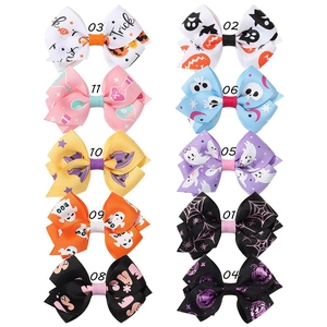 Set of 10 Halloween hair clips with pumpkin and ghost patterns on ribbed ribbons