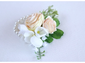 Wrist corsage with champagne artificial roses, white florets and pearl bracelet