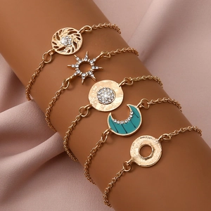 Bohemian gold plated 5-piece bracelet set featuring crescent moon and sun motifs