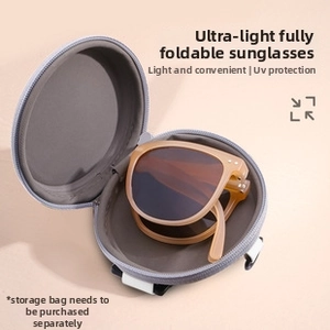 Detail view of foldable round sunglasses with tan frame and compact grey zipper case