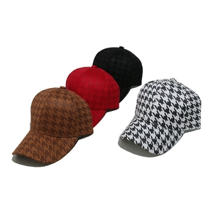 Houndstooth pattern baseball caps in brown, red, and black on a white background