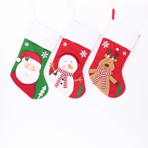 Set of 3 Christmas stockings with Santa, Snowman, and Reindeer plush decorations