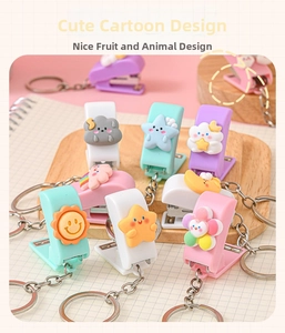 Detailed macro view of cute pastel mini stapler keychains with 3D weather cartoon icons