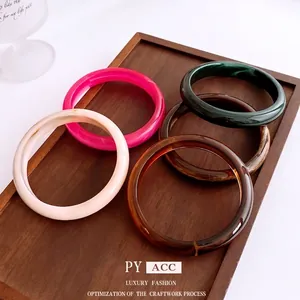 Retro minimalist acrylic resin bangles in diverse colorful marbled and tortoiseshell patterns