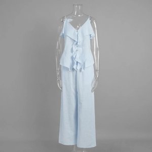 Detail of light blue cotton set featuring ruffled camisole top and wide-leg trousers