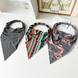 Three long cotton triangle hair scarves in wave, ethnic, and floral patterns