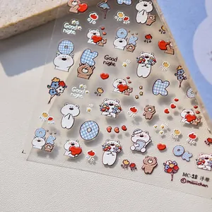 Detailed macro of 3D embossed cartoon bear nail stickers with hearts and text