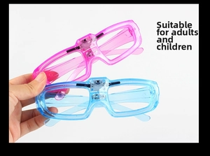 Detail view of pink and blue LED square glasses with visible electronic circuits for parties