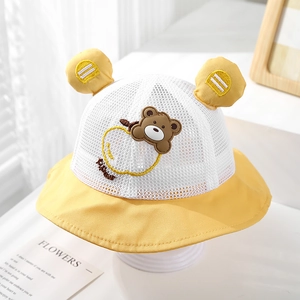 Detail of yellow baby bucket hat with breathable white mesh and cute bear ears