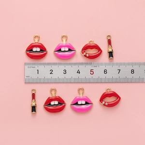 Lip and lipstick alloy pendants for DIY jewelry making shown with size ruler