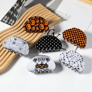 Set of 6 Halloween hair claws featuring pumpkin and spider motifs in orange and black