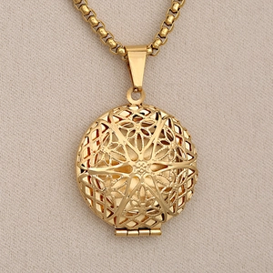 Vintage golden stainless steel locket necklace with intricate filigree pattern for women